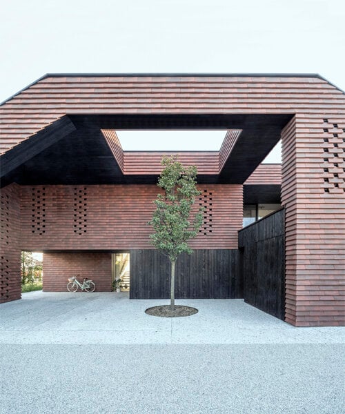 brick-tiled canopy doubles as playground for OFIS architects' frame house in slovenia